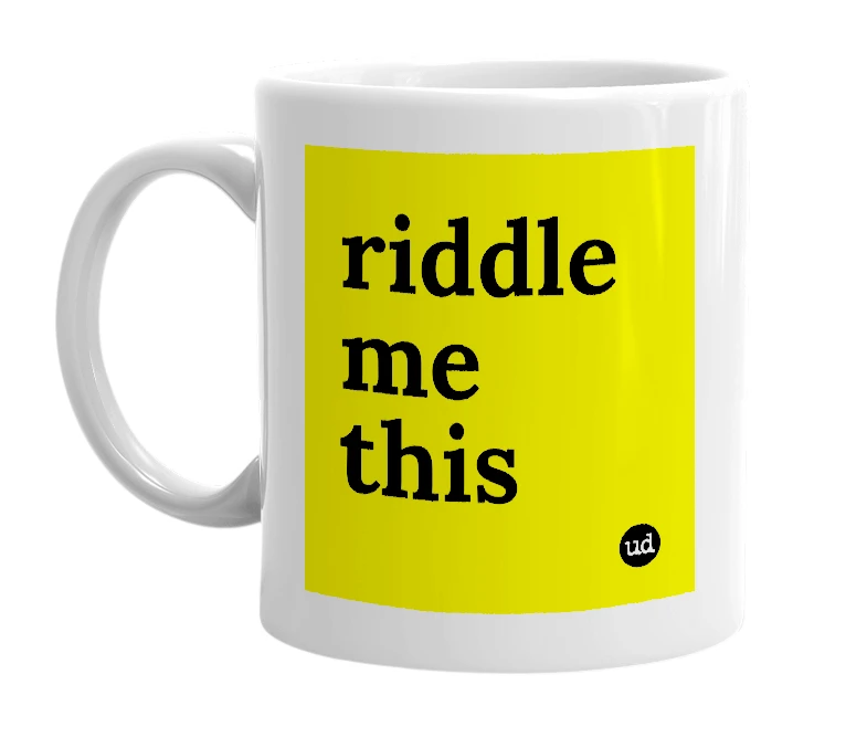White mug with 'riddle me this' in bold black letters
