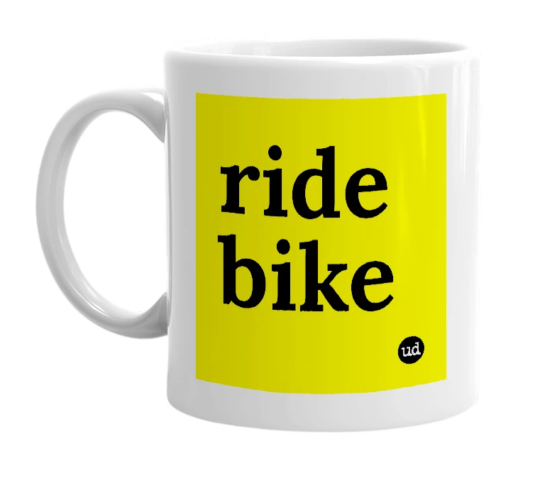 White mug with 'ride bike' in bold black letters