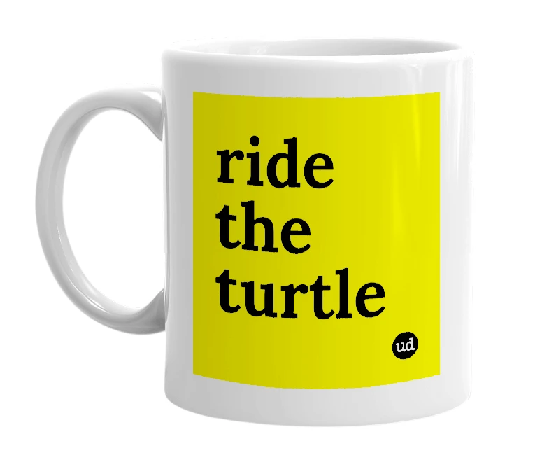 White mug with 'ride the turtle' in bold black letters