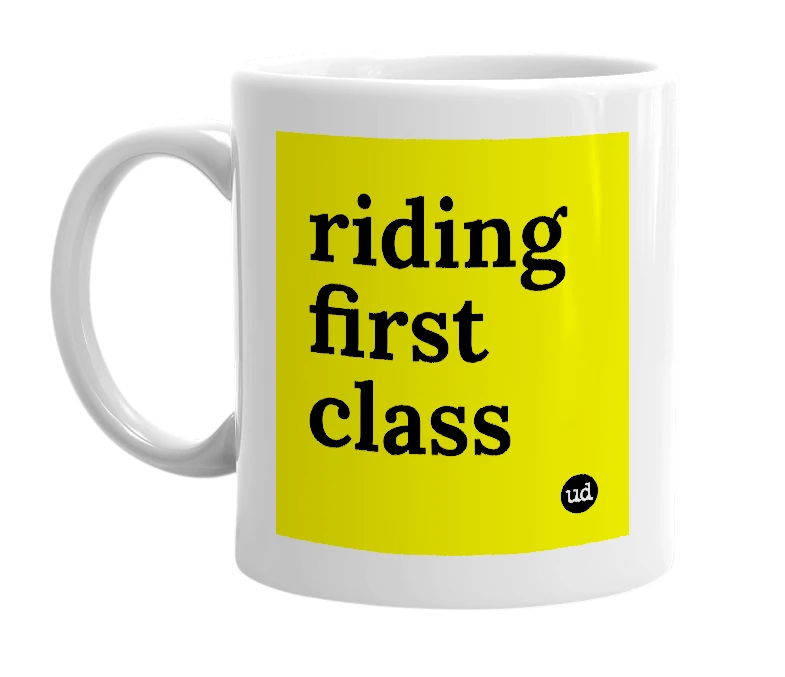 White mug with 'riding first class' in bold black letters