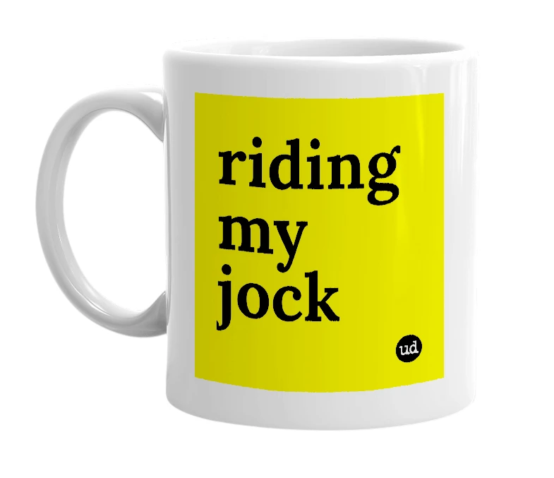 White mug with 'riding my jock' in bold black letters