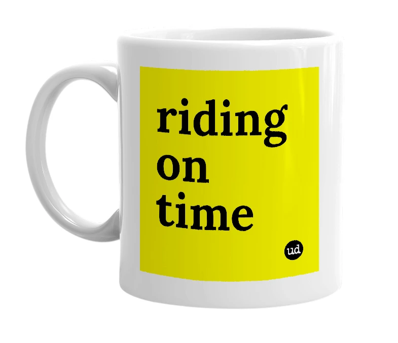 White mug with 'riding on time' in bold black letters
