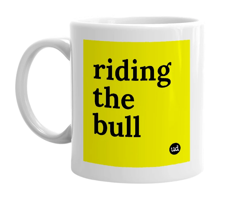 White mug with 'riding the bull' in bold black letters