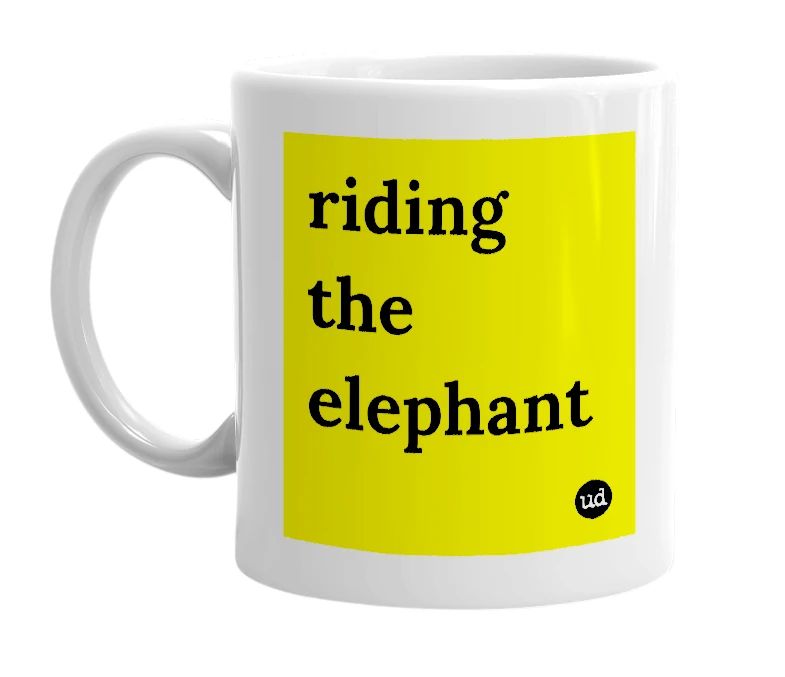 White mug with 'riding the elephant' in bold black letters
