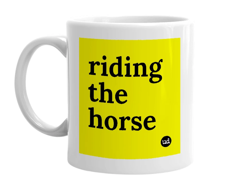 White mug with 'riding the horse' in bold black letters
