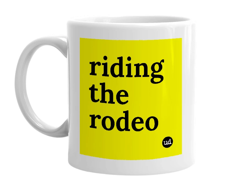 White mug with 'riding the rodeo' in bold black letters