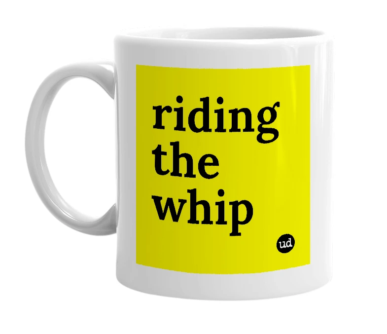 White mug with 'riding the whip' in bold black letters