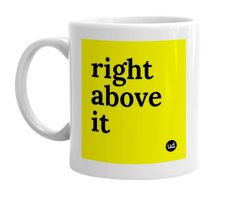 White mug with 'right above it' in bold black letters