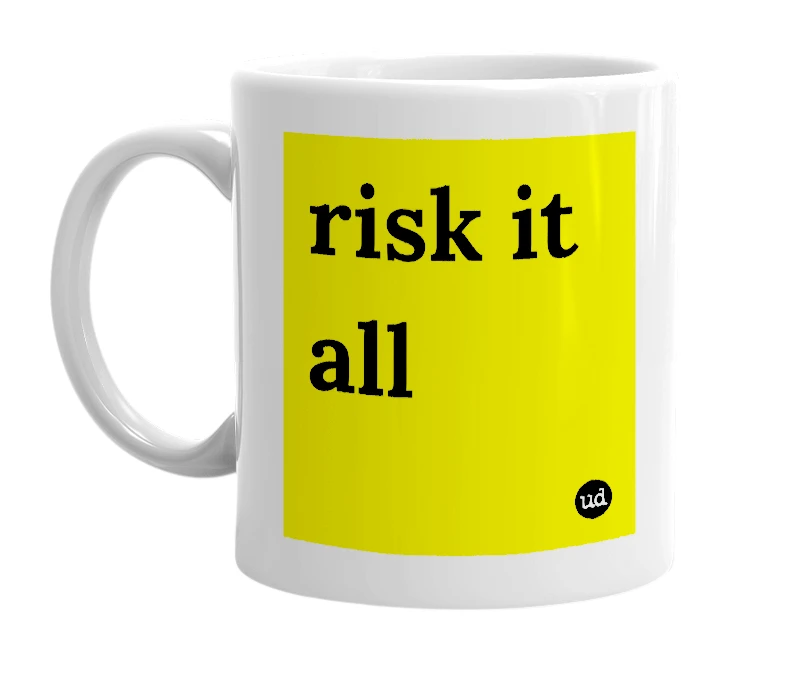 White mug with 'risk it all' in bold black letters