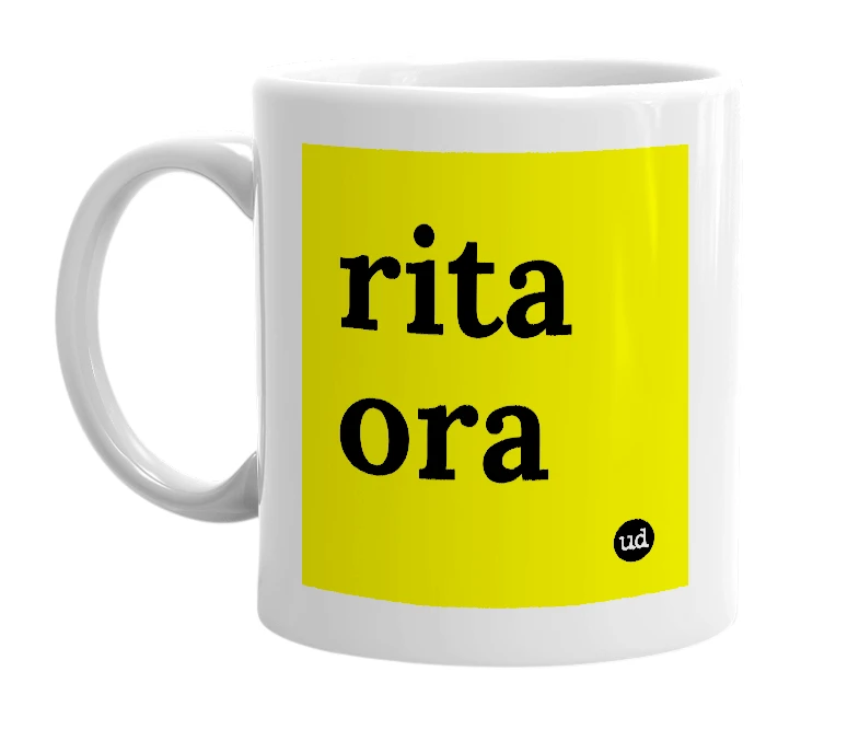 White mug with 'rita ora' in bold black letters