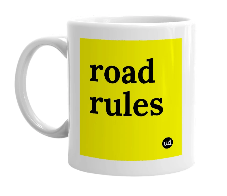 White mug with 'road rules' in bold black letters