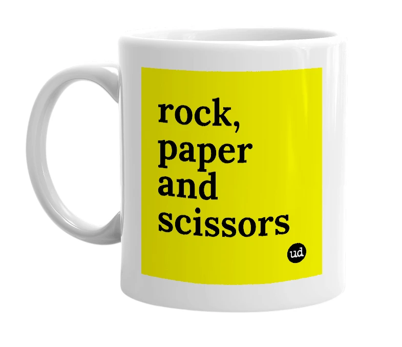 White mug with 'rock, paper and scissors' in bold black letters