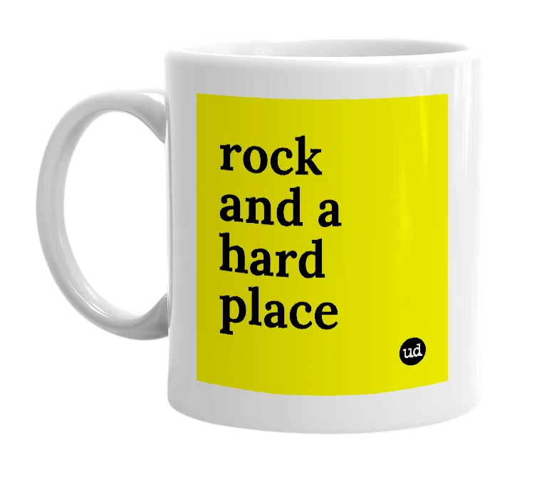 White mug with 'rock and a hard place' in bold black letters
