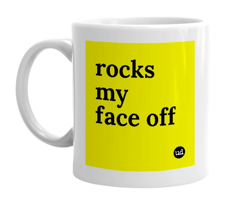 White mug with 'rocks my face off' in bold black letters