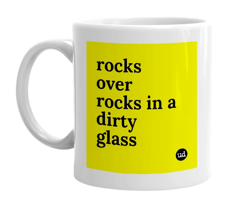 White mug with 'rocks over rocks in a dirty glass' in bold black letters