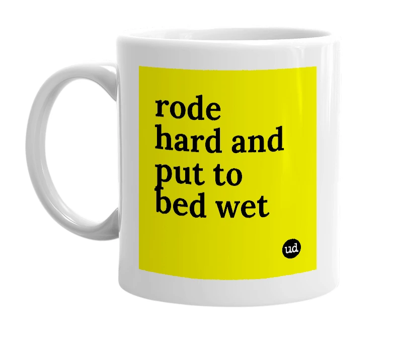 White mug with 'rode hard and put to bed wet' in bold black letters