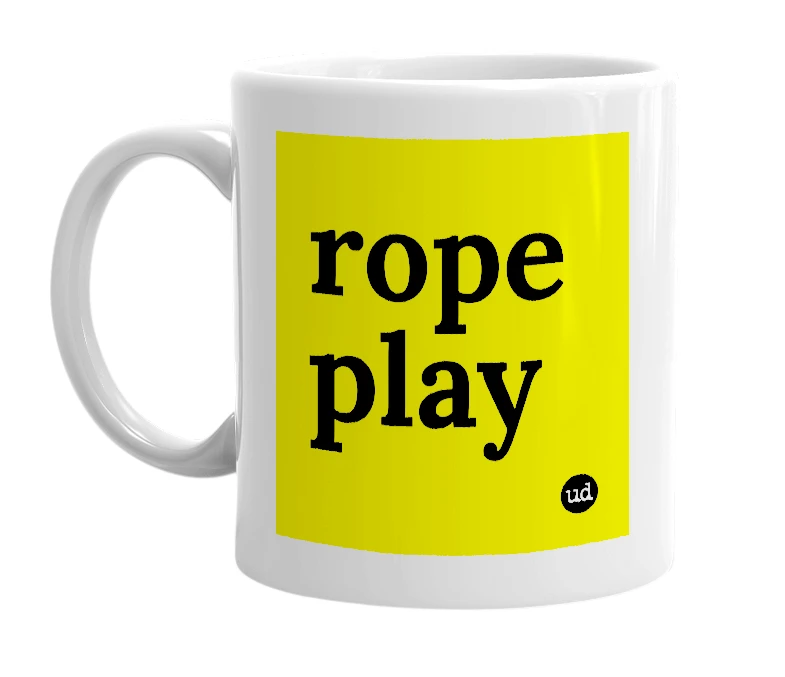 White mug with 'rope play' in bold black letters