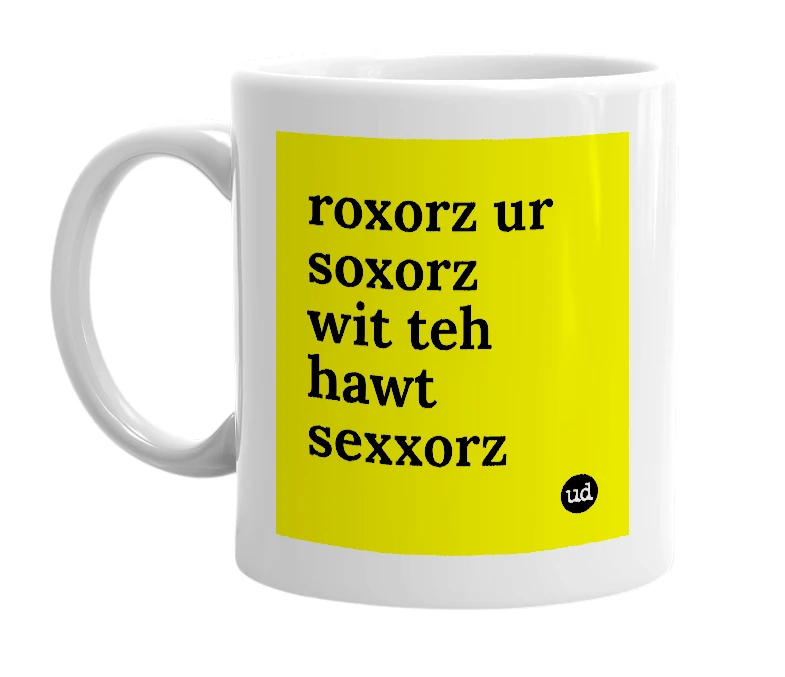 White mug with 'roxorz ur soxorz wit teh hawt sexxorz' in bold black letters