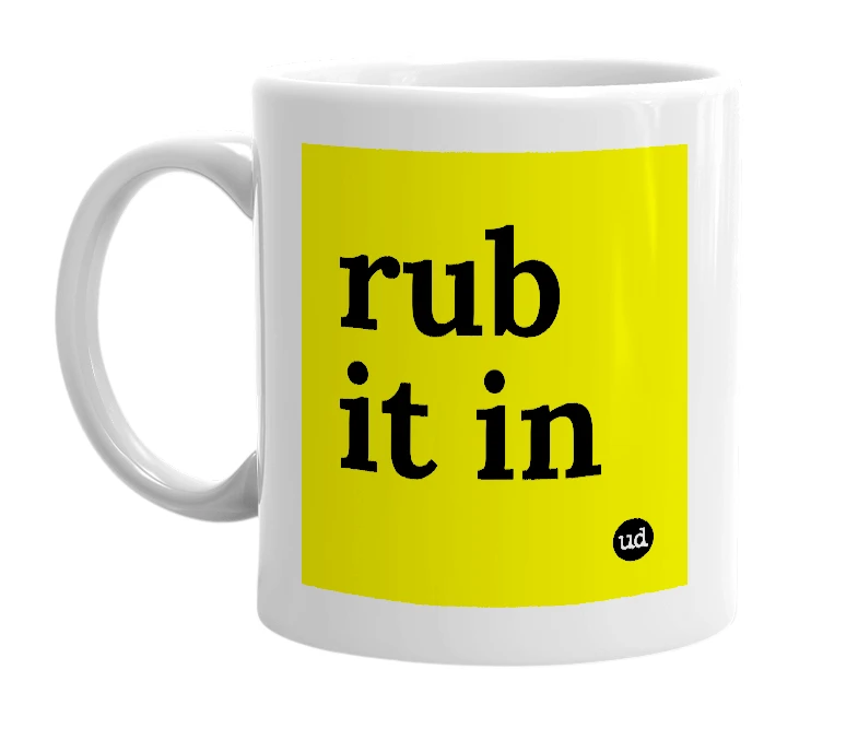 White mug with 'rub it in' in bold black letters