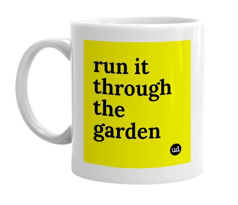 White mug with 'run it through the garden' in bold black letters