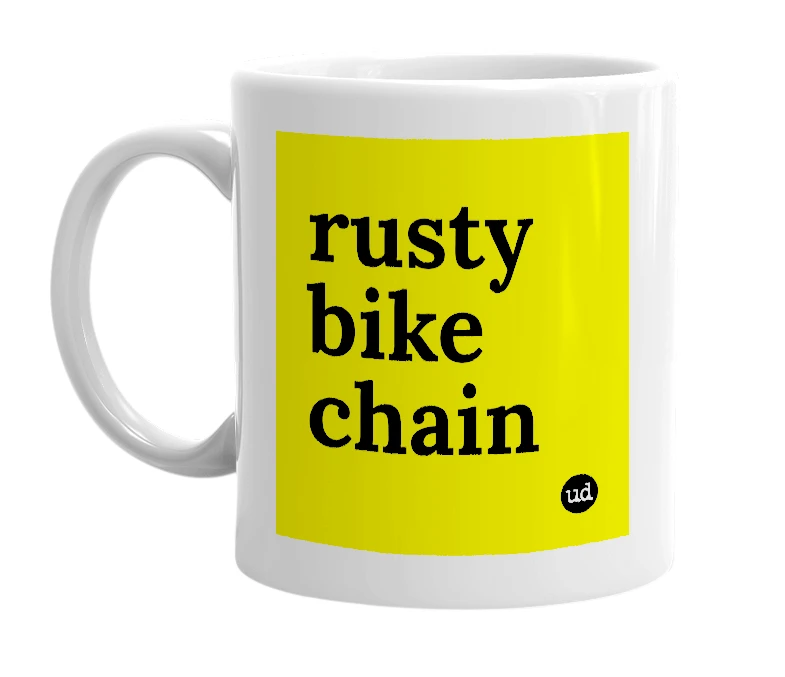 White mug with 'rusty bike chain' in bold black letters