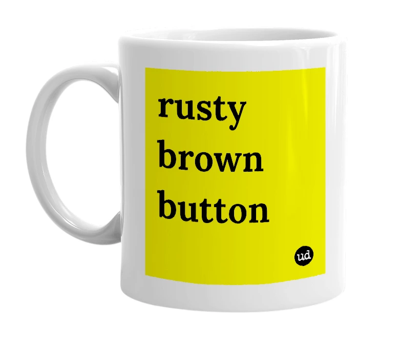 White mug with 'rusty brown button' in bold black letters