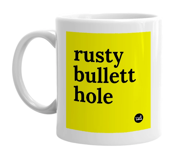 White mug with 'rusty bullett hole' in bold black letters