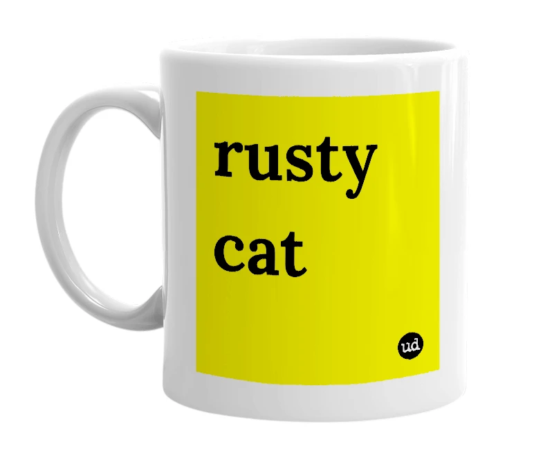 White mug with 'rusty cat' in bold black letters