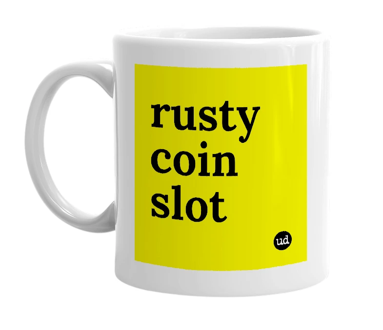 White mug with 'rusty coin slot' in bold black letters