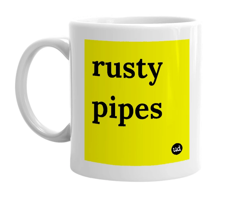 White mug with 'rusty pipes' in bold black letters