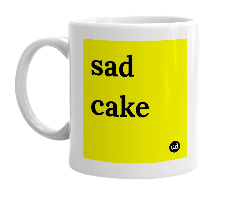 White mug with 'sad cake' in bold black letters