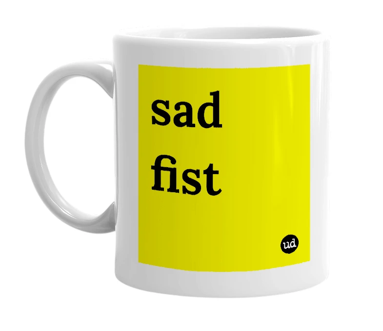 White mug with 'sad fist' in bold black letters