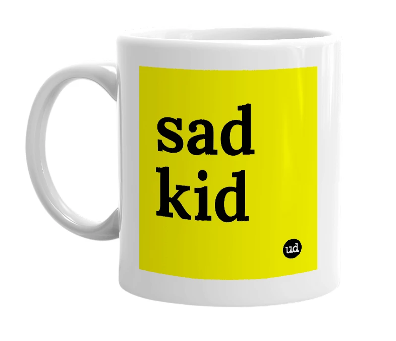 White mug with 'sad kid' in bold black letters