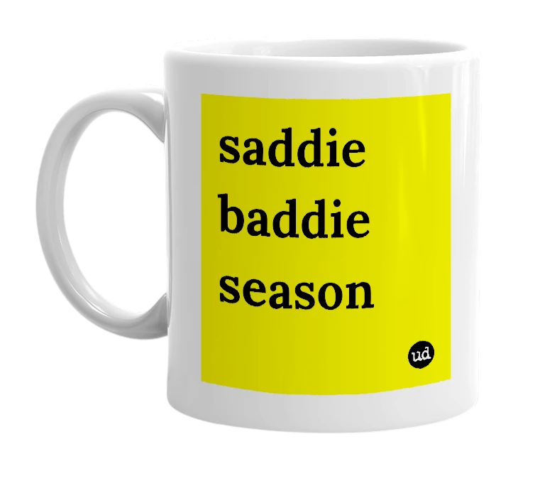 White mug with 'saddie baddie season' in bold black letters