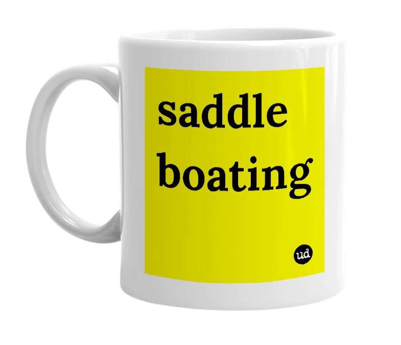 White mug with 'saddle boating' in bold black letters