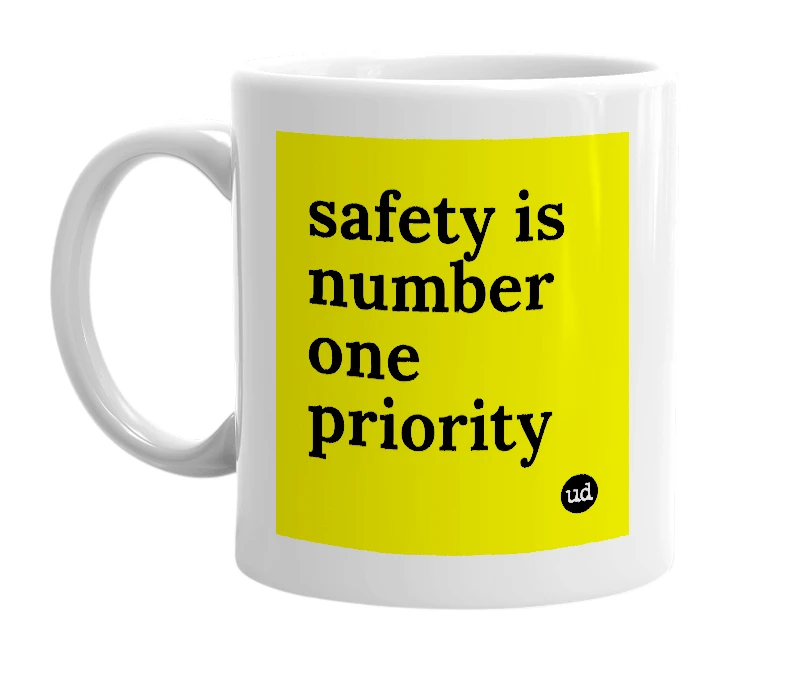 White mug with 'safety is number one priority' in bold black letters