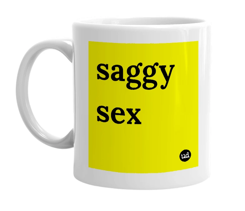 White mug with 'saggy sex' in bold black letters