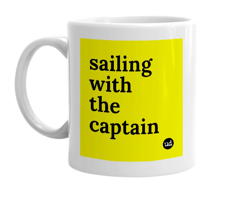 White mug with 'sailing with the captain' in bold black letters