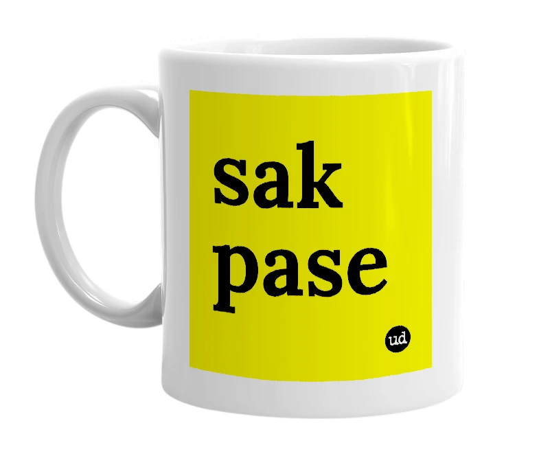 White mug with 'sak pase' in bold black letters