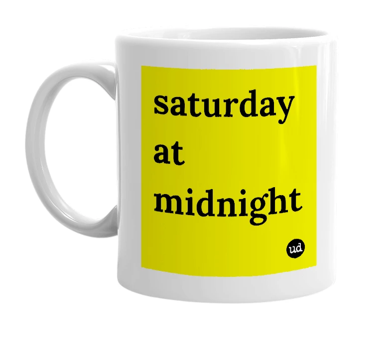 White mug with 'saturday at midnight' in bold black letters