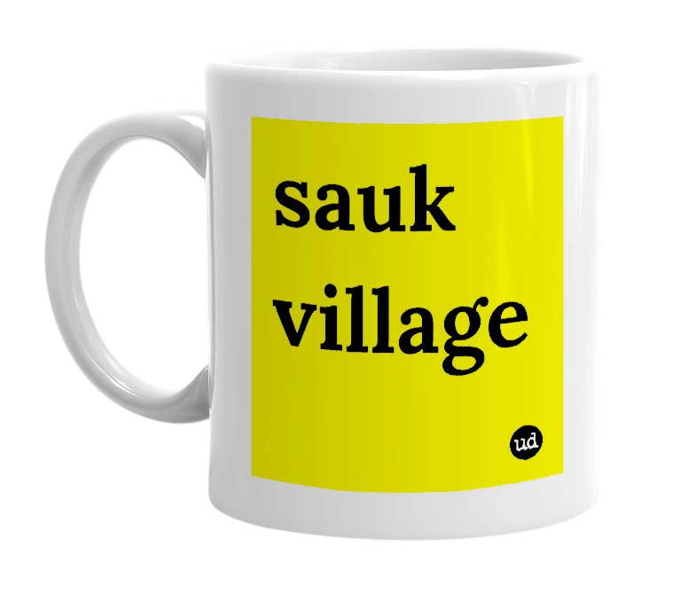 White mug with 'sauk village' in bold black letters