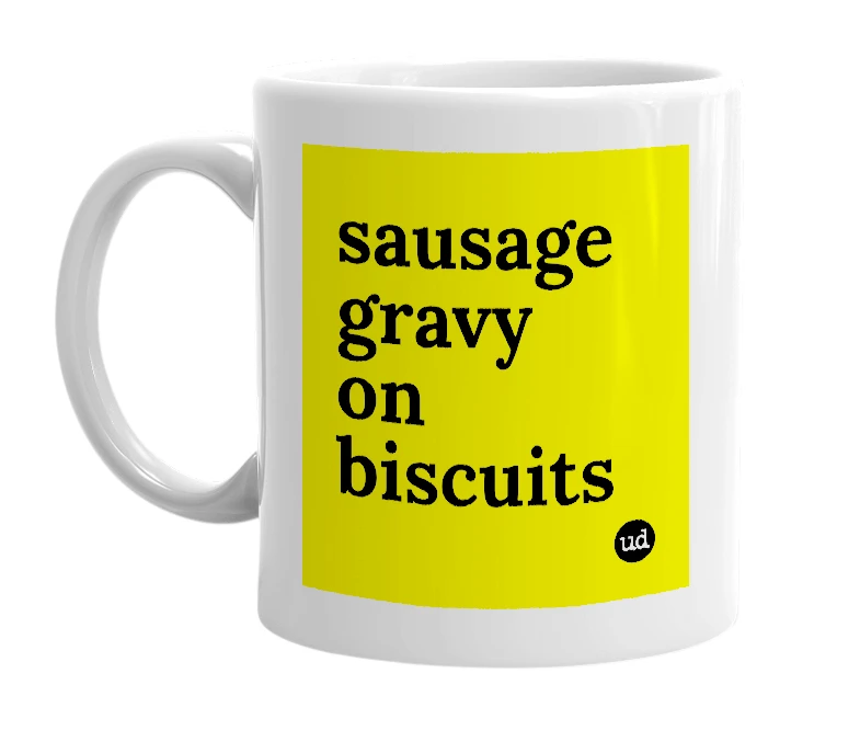 White mug with 'sausage gravy on biscuits' in bold black letters