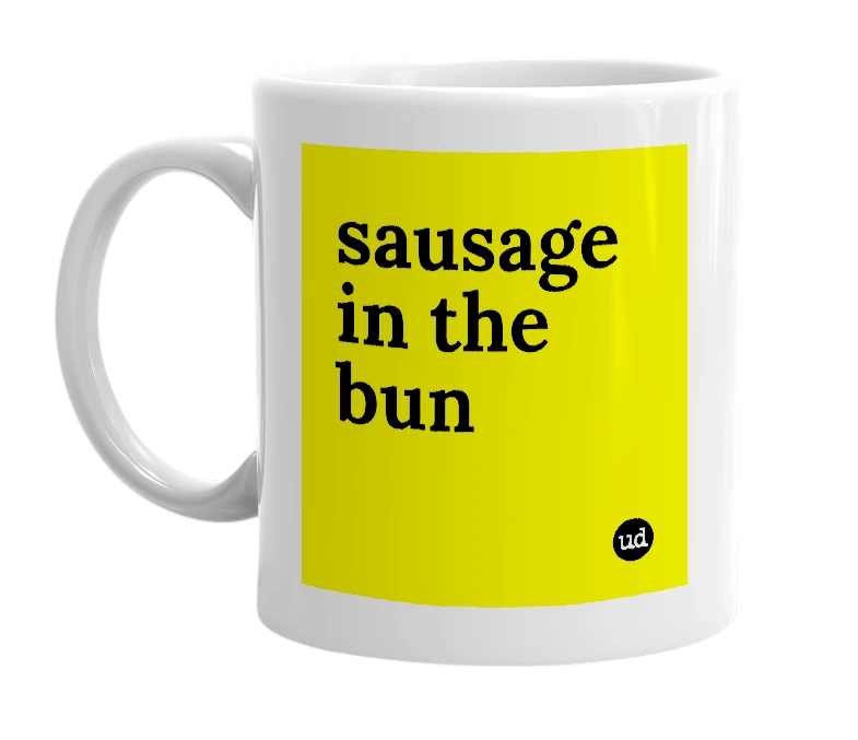 White mug with 'sausage in the bun' in bold black letters