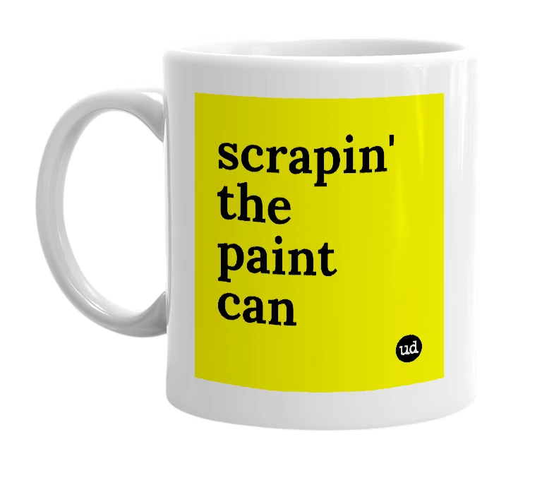 White mug with 'scrapin' the paint can' in bold black letters