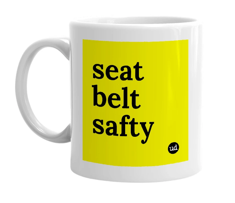 White mug with 'seat belt safty' in bold black letters