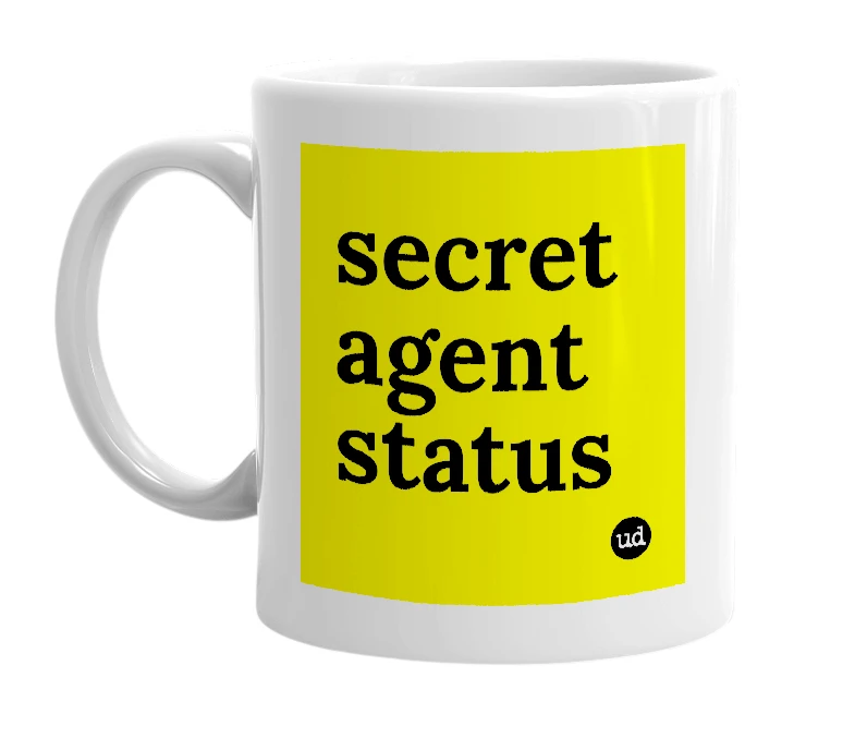 White mug with 'secret agent status' in bold black letters