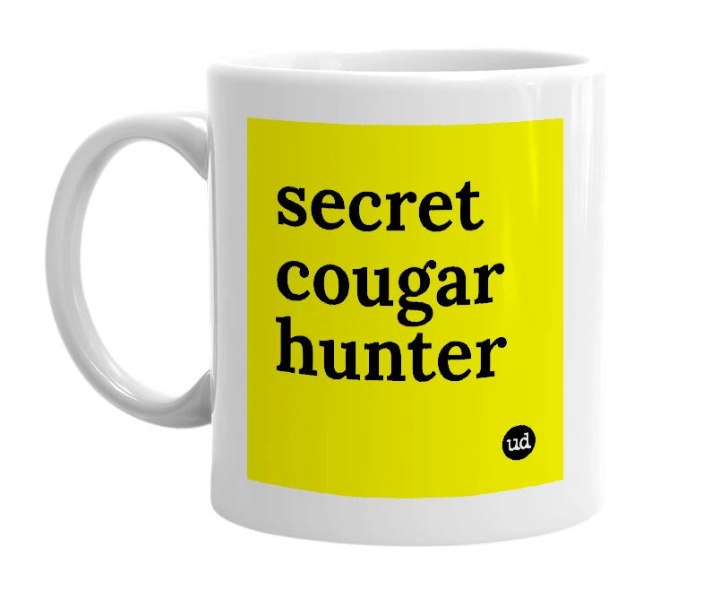 White mug with 'secret cougar hunter' in bold black letters