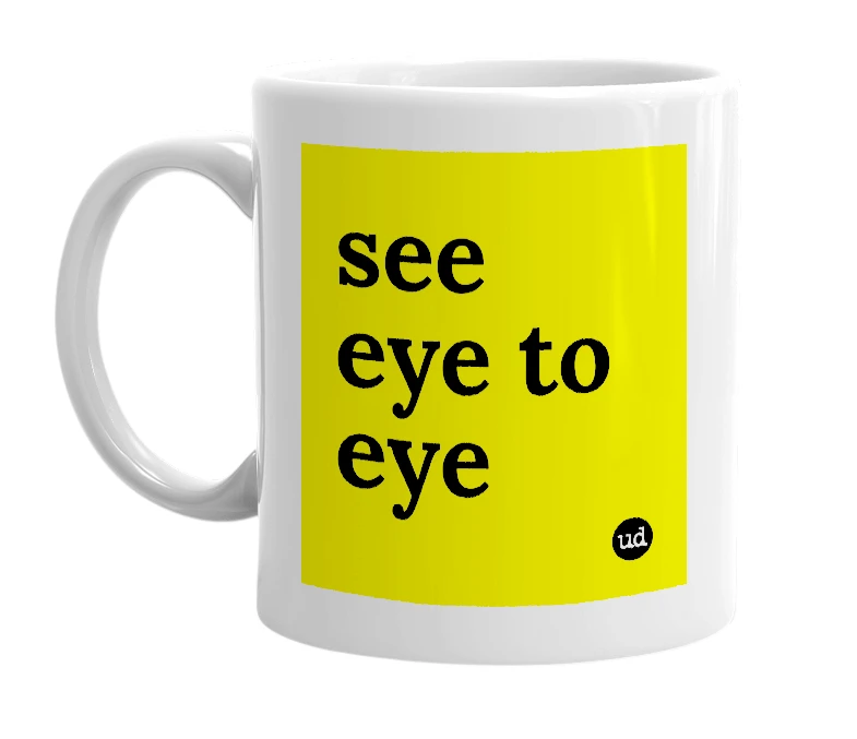 White mug with 'see eye to eye' in bold black letters