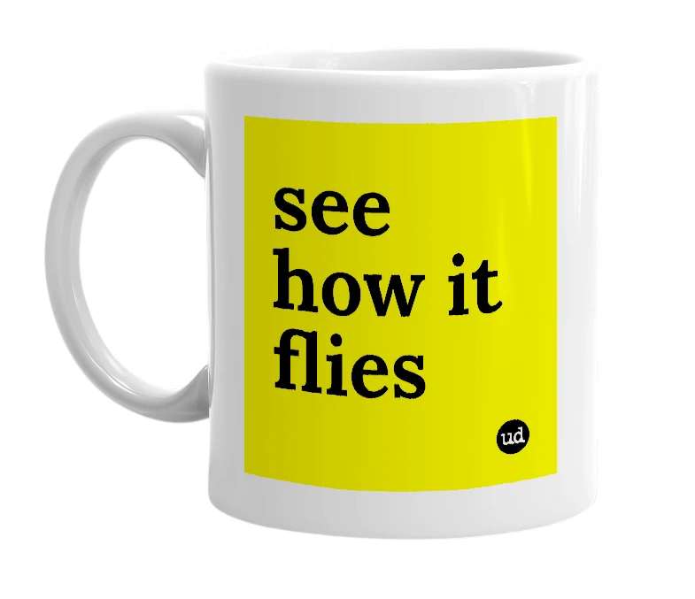 White mug with 'see how it flies' in bold black letters