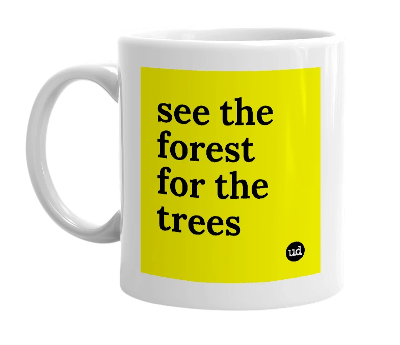 White mug with 'see the forest for the trees' in bold black letters